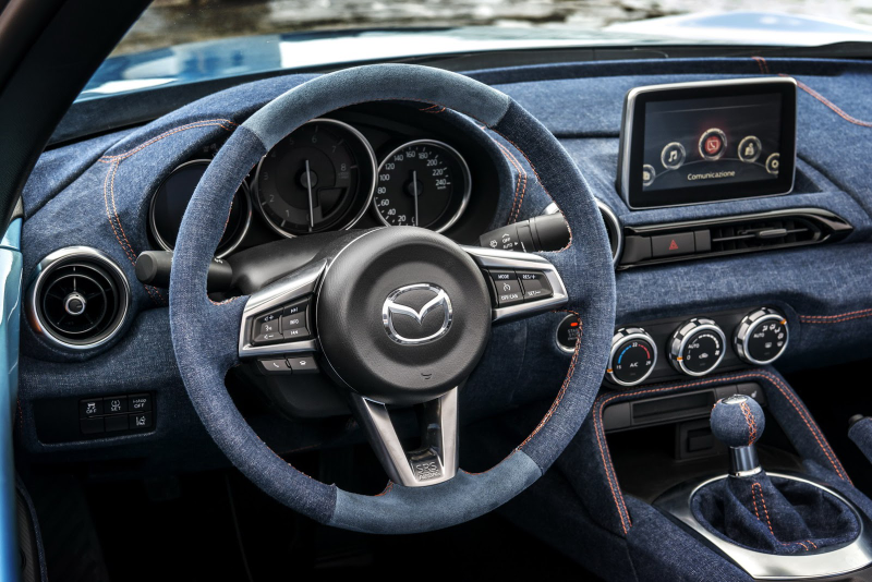 Illustration for article titled Placate Your Fears Of Global Economic Collapse With This Two-Tone Miata With A Denim Interior